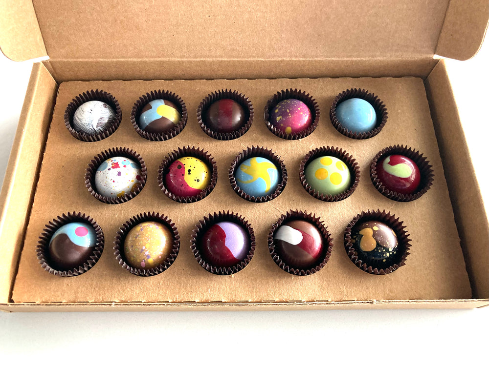 15 Piece House favorites.  Our house-made bon bons, hand-painted with all-natural cocoa butter. Hand-selected by the staff of our best available selection. Allergies? Leave us a message in the comments to let us know!